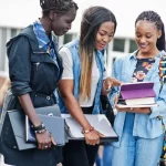 depositphotos_314228292-stock-photo-three-african-students-female-posed